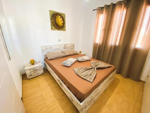 Ein Bett oder Betten in einem Zimmer der Unterkunft Golden View House