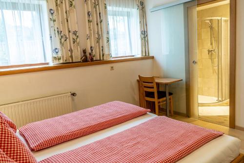 Postel nebo postele na pokoji v ubytování Haus Mandl