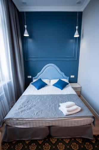 Postel nebo postele na pokoji v ubytování ARENA Hotel