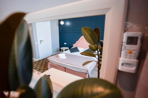 Postel nebo postele na pokoji v ubytování ARENA Hotel