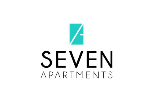 a sign for a seven apartments logo at 7 Apartments in Lviv