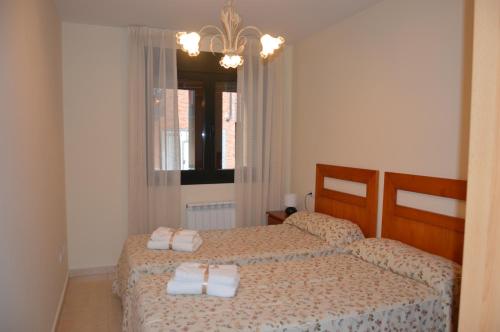Postel nebo postele na pokoji v ubytování Apartamento Las Pontigas