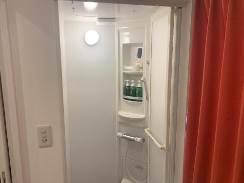 a bathroom with a refrigerator with drinks in it at Sado - Hotel - Vacation STAY 82495 in Sado