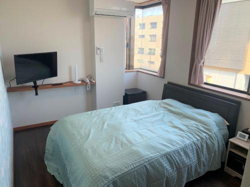 Łóżko lub łóżka w pokoju w obiekcie Sado - Hotel - Vacation STAY 82495