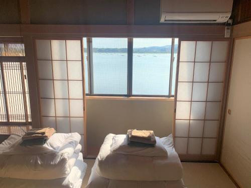 En eller flere senger på et rom på Sado - Hotel - Vacation STAY 82479