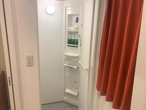 a small refrigerator with drinks inside of it at Sado - Hotel - Vacation STAY 82496 in Sado