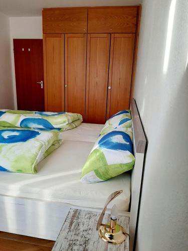 a bedroom with two twin beds and a table at Apartment Anja in Schluchsee