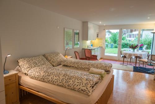 a living room with a couch and a dining room at Grava - Ferienwohnung für max. 2 Personen in Laax