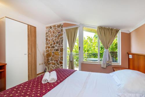 En eller flere senger på et rom på Olive House Zadar