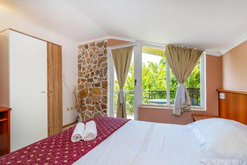 Posteľ alebo postele v izbe v ubytovaní Olive House Zadar
