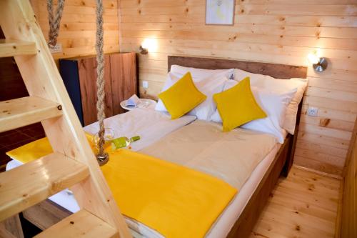 a bedroom with a bed in a wooden cabin at Cottage Lana in Jajce
