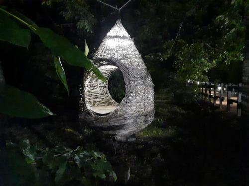a stone sculpture of a snake in a yard at Casa etna in Bronte