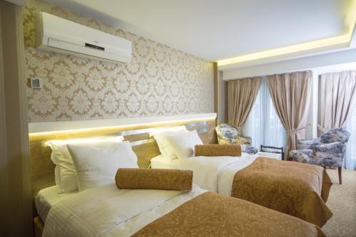 Katil atau katil-katil dalam bilik di Golden Rain Hotel Old City