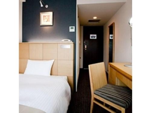 A bed or beds in a room at Hotel St Palace Kurayoshi - Vacation STAY 82268