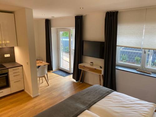 Un pat sau paturi într-o cameră la Bauernhaus Loth - exklusive Ferienwohnungen
