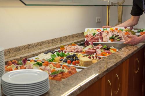 a buffet line with many different types of food at Hotel Mohren in Oberstdorf