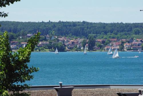 a large body of water with sail boats in it at Am Strandweg in Überlingen