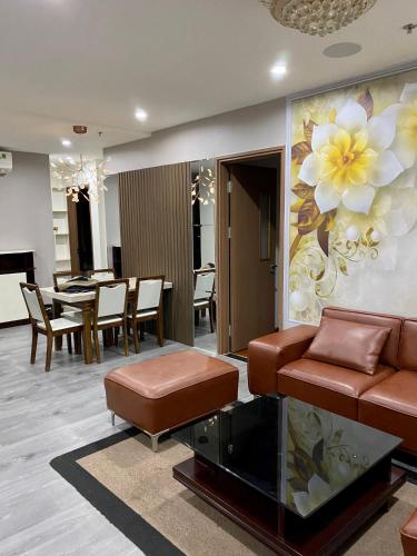 a living room with a couch and a table at SHP Plaza Khanh Phong Homestay in Hai Phong