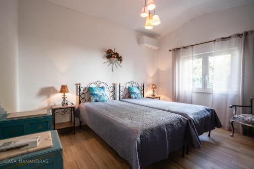 Кровать или кровати в номере Casa Bananeiras
