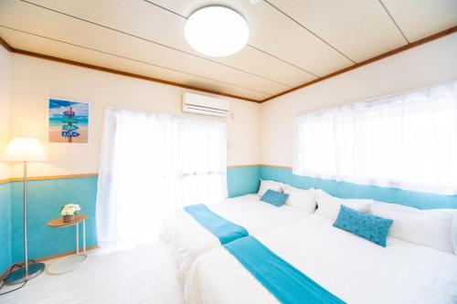 Postel nebo postele na pokoji v ubytování Awaji Central House in Kusumoto