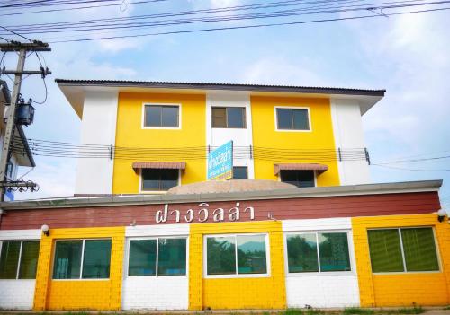 a yellow and white building at Fang villa mansion in Fang