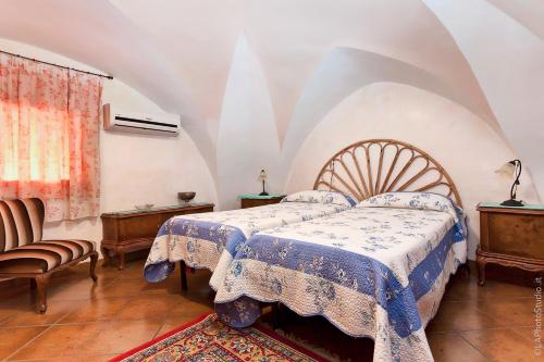 Un pat sau paturi într-o cameră la Villa Delle Palme