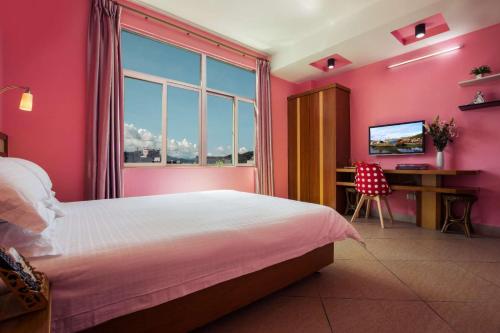 Krevet ili kreveti u jedinici u okviru objekta Sanya Tropical Coast Hotel