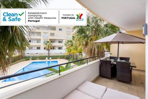 a view of the pool from the balcony of a hotel at Spacious Apartment with Huge Terrace and Swimming Pool in Lagos