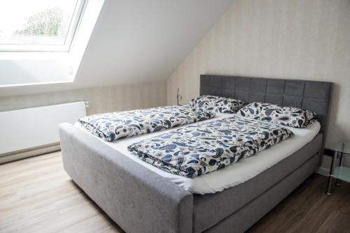 a large bed in a room with at Stadtoase in Bremerhaven