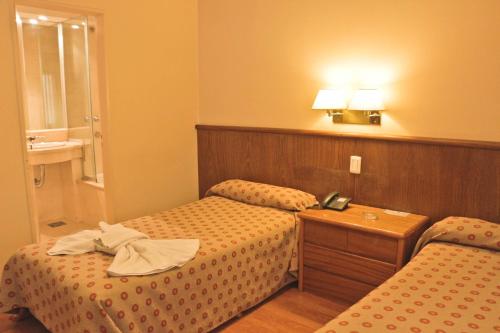 Hotel Felipe IIにあるベッド