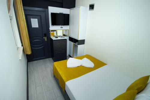 Ένα ή περισσότερα κρεβάτια σε δωμάτιο στο Exporoyal Hotel
