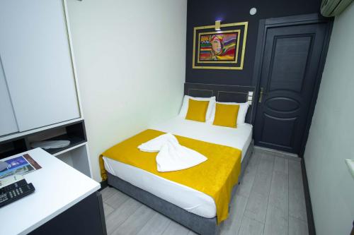 Ένα ή περισσότερα κρεβάτια σε δωμάτιο στο Exporoyal Hotel