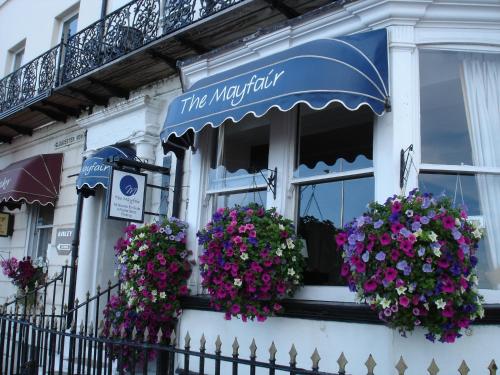 a building with a window with flowers on it at The Mayfair in Weymouth