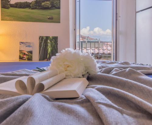 A bed or beds in a room at Casa La Nuvola Varenna