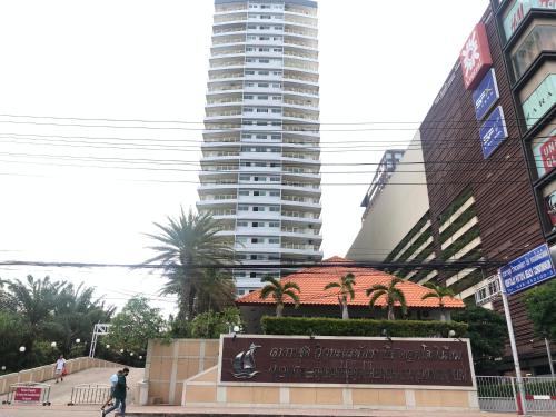 a tall building with a sign in front of it at View Talay 6 Pattaya Beach Apartment by Honey in Pattaya