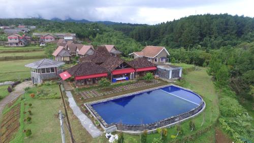 an aerial view of a house with a swimming pool at Degung Hillside in Bogor
