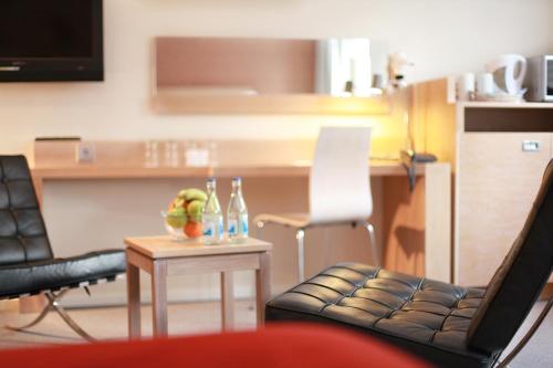 a living room filled with furniture and a chair at Spar Hotel Majorna in Gothenburg
