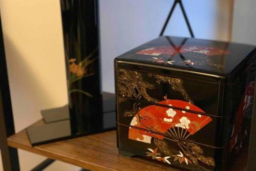 a black box with a picture at TRAD GUEST HOUSE KYOTO Kyomachiya in Kyoto