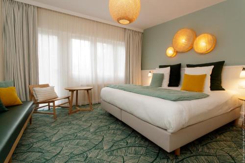 Katil atau katil-katil dalam bilik di Le Manoir Hôtel