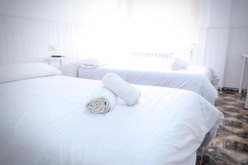 Katil atau katil-katil dalam bilik di Hostal Jaufil