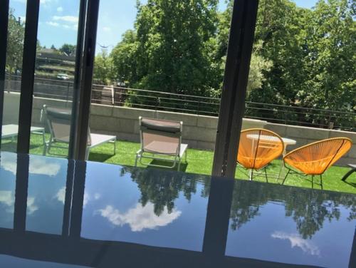 Taman di luar Le Magic Hôtel & Spa