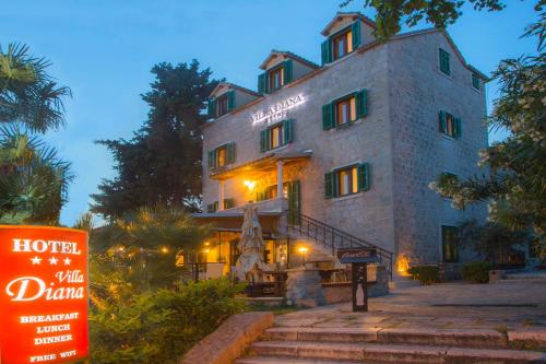 a building with a sign in front of it at Hotel Villa Diana in Split