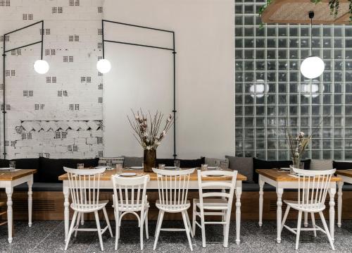 a dining room with a table and chairs at Ergon House Athens in Athens