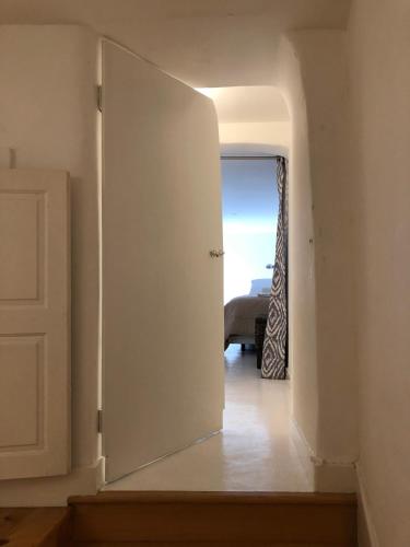 a hallway with an open door to a room at PortoSense Almada in Porto