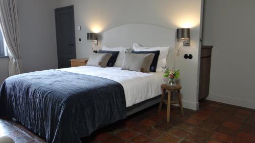 Postel nebo postele na pokoji v ubytování Bed & Breakfast De Oude Heerd