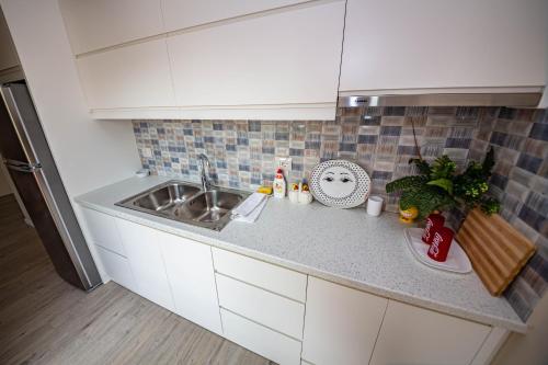 a kitchen with a sink and a counter top at Villa Abiori in Ksamil