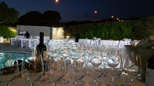 a bunch of empty wine glasses sitting on a table at Sunshine Club Hotel Centro Benessere in Ricadi