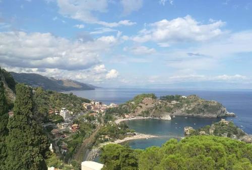 a view of a small island in the water at Matteo's House Taormina in Taormina