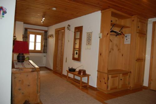 a room with a room with a table and a door at Chasa Städler - Ferienwohnung mit 113m2 für max. 5 Personen in Zernez