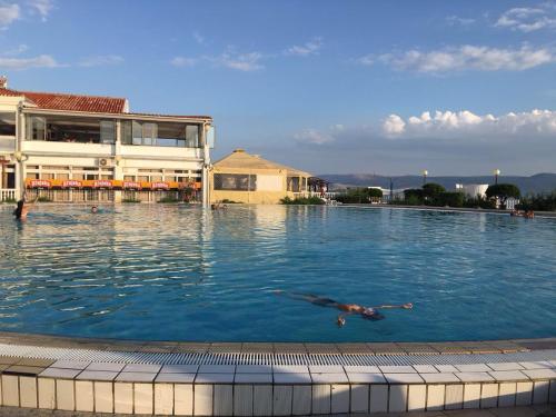 a person swimming in a large swimming pool at Apartment Svetlana in Selce